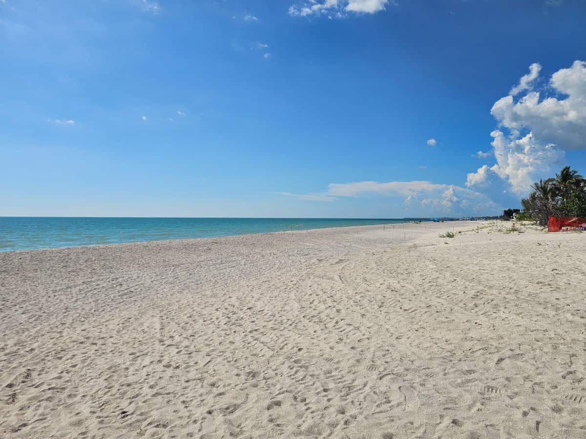 looking down a wide expanse of beach to the Gulf of Mexico
