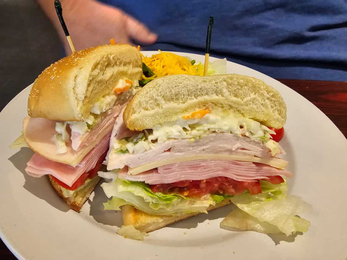 Dagwood sandwich on a white plate