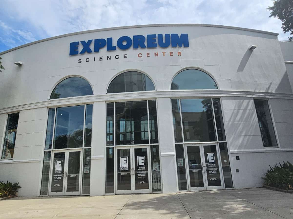 Exploreum Science Center over large windows and entrance doors