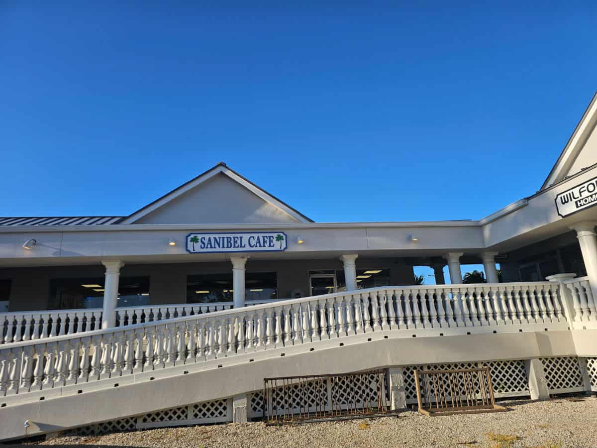 Sanibel Cafe sign over a ramp leading up to the restaurant