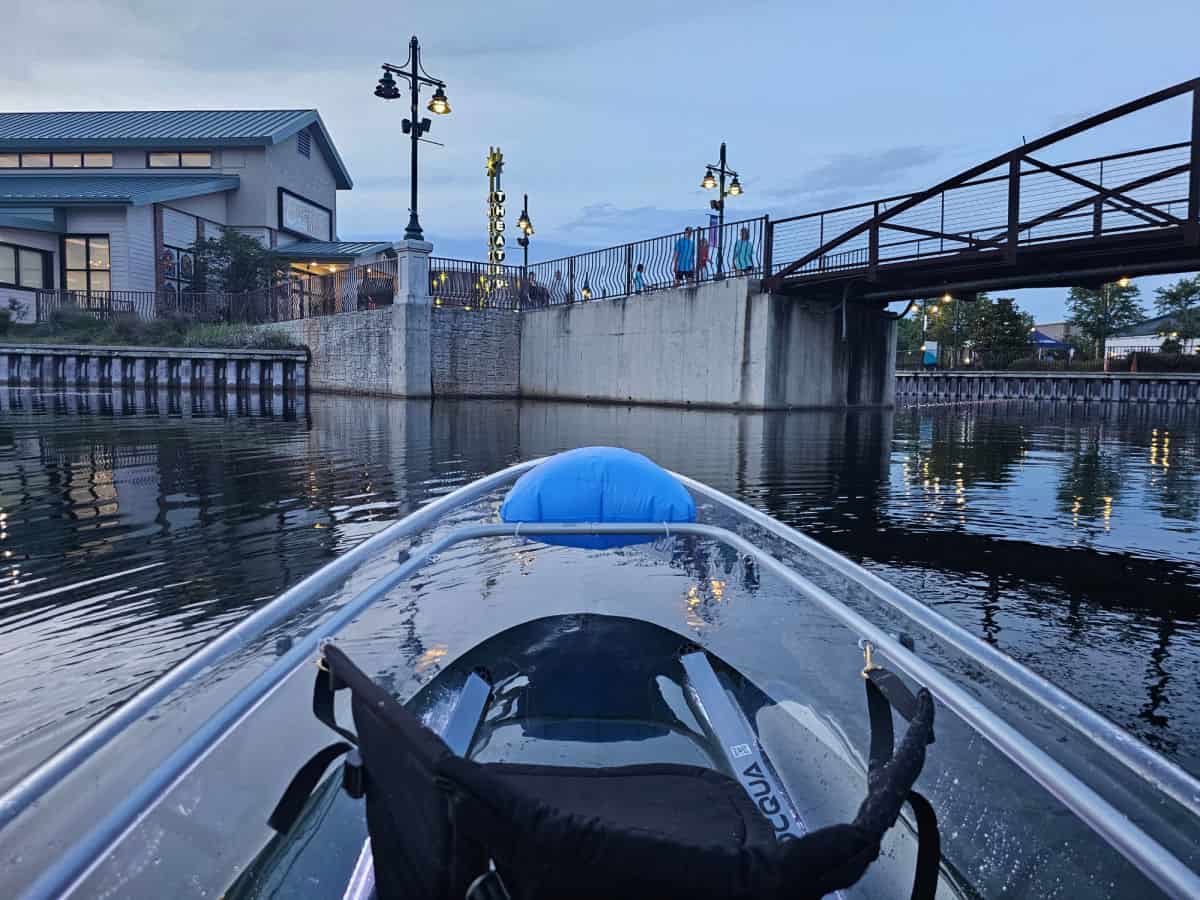 clear kayak inOWA with a bridge