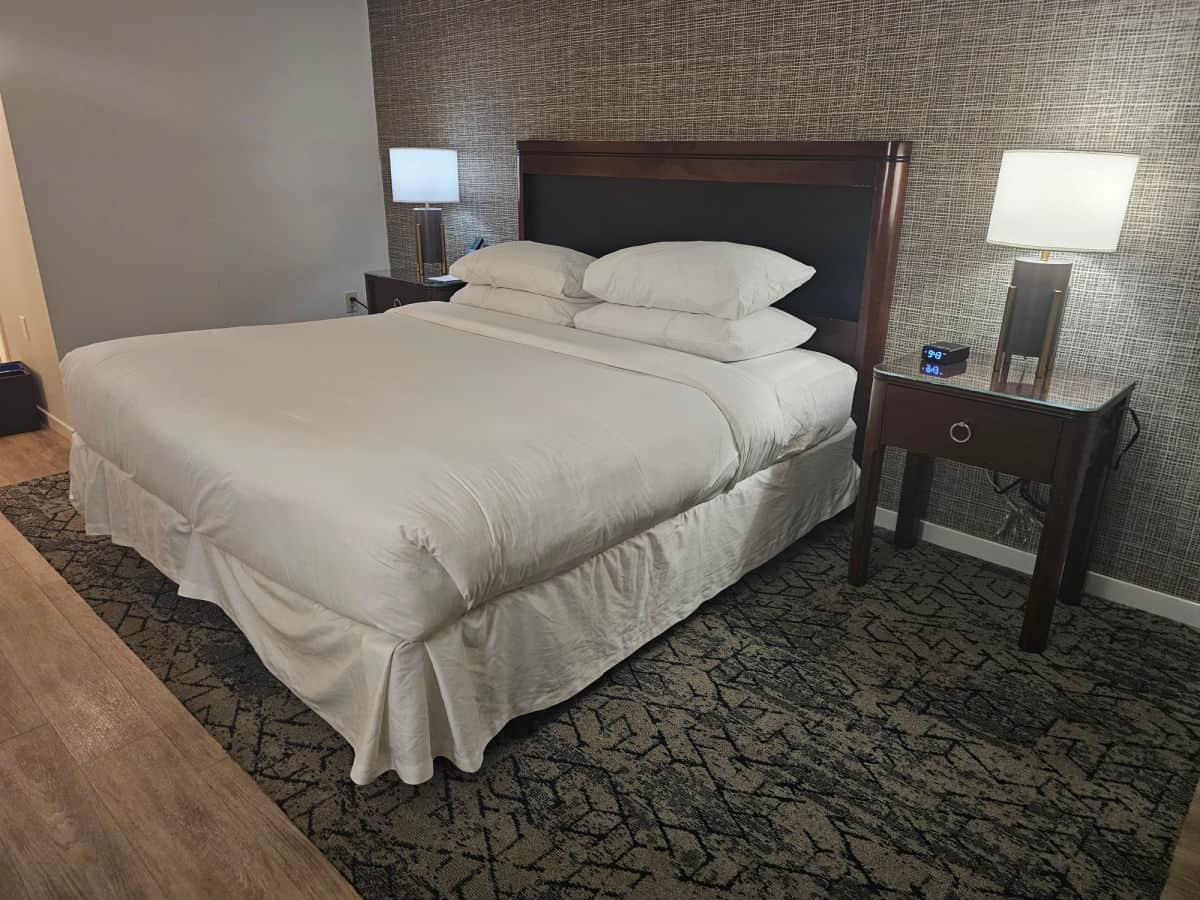 King size bed with lamps and nightstands on either side