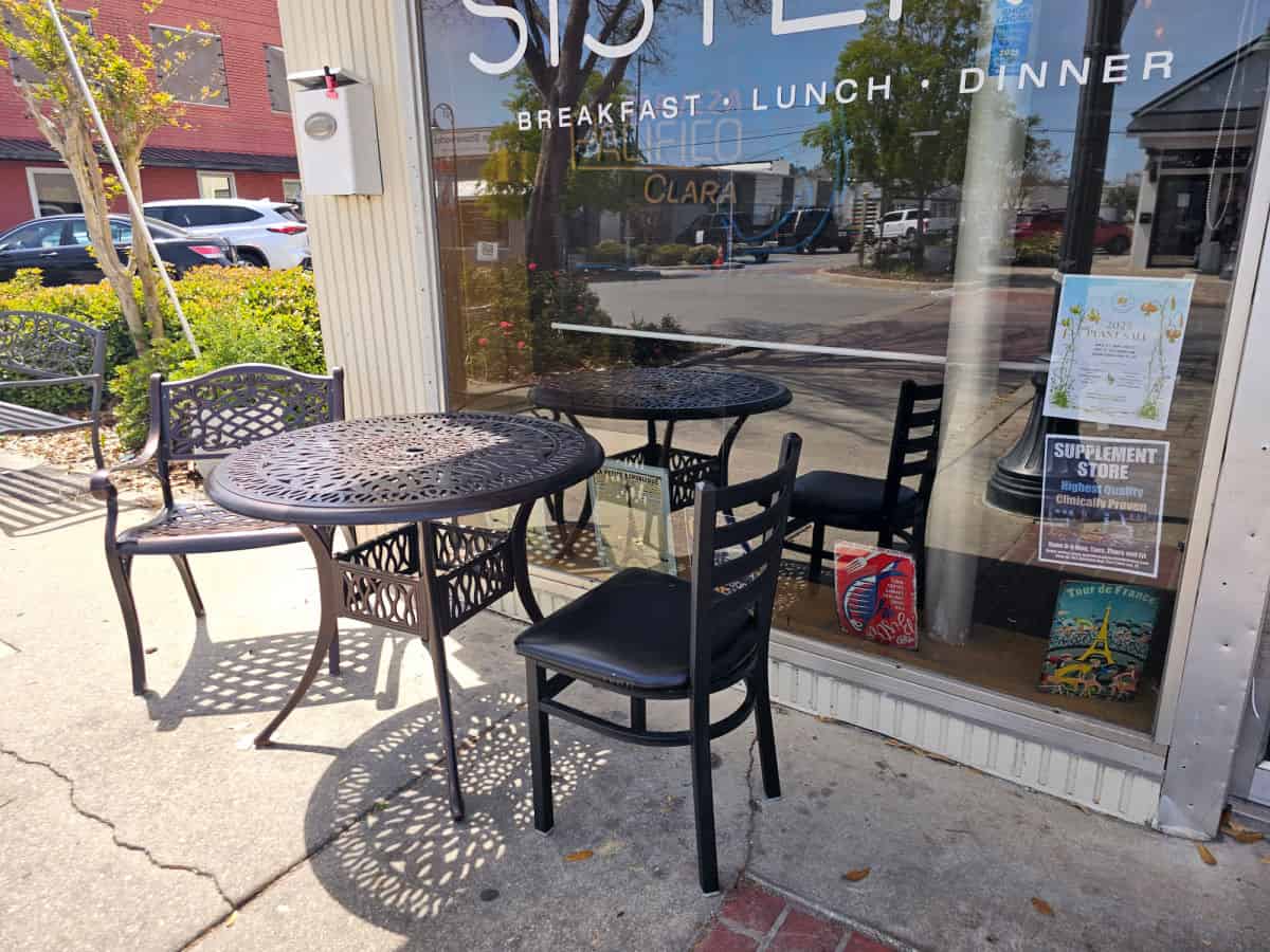 table next to the window of Sister's bistro with two chairs