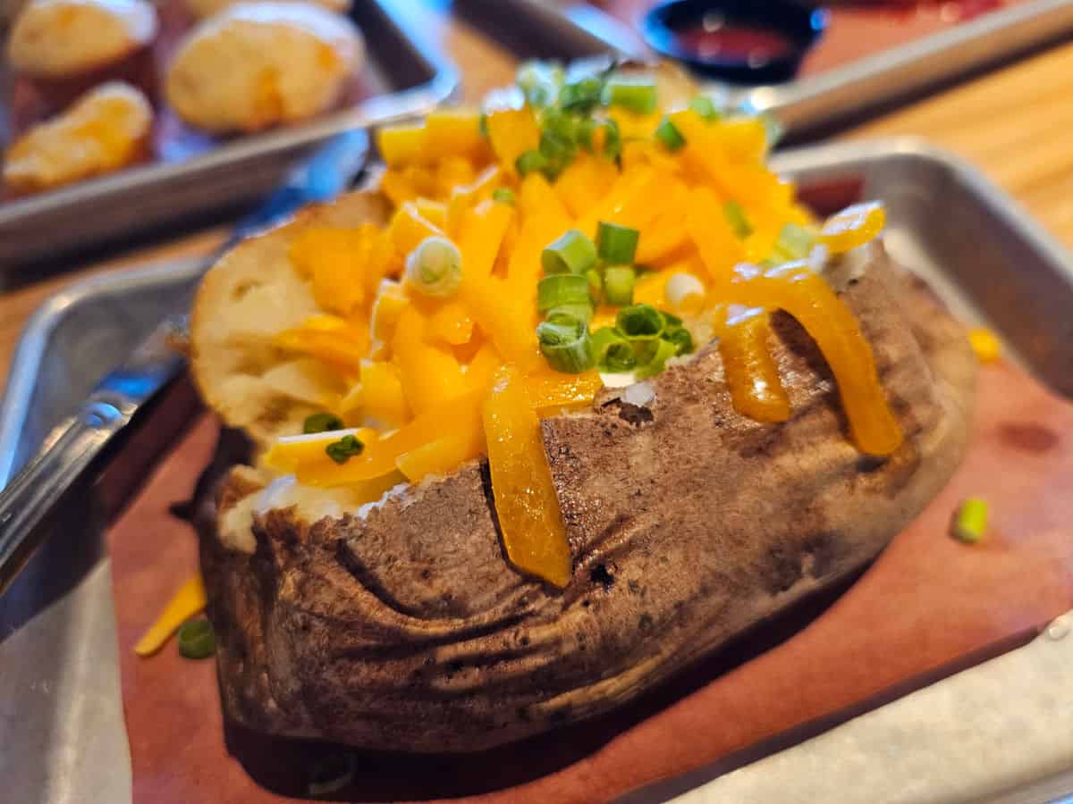 plain baked potato with cheese and chives