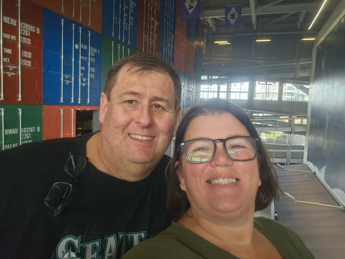 Tammilee and John in front of containers at the national maritime museum