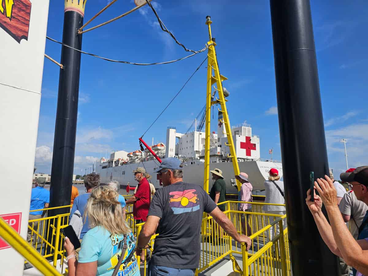 People standing on the top deck of the Perdido Queen paddleboat