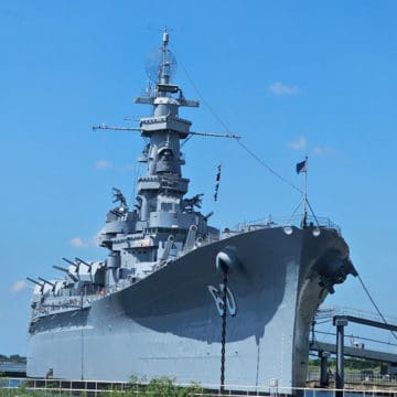 USS Alabama ship on a blue sky day