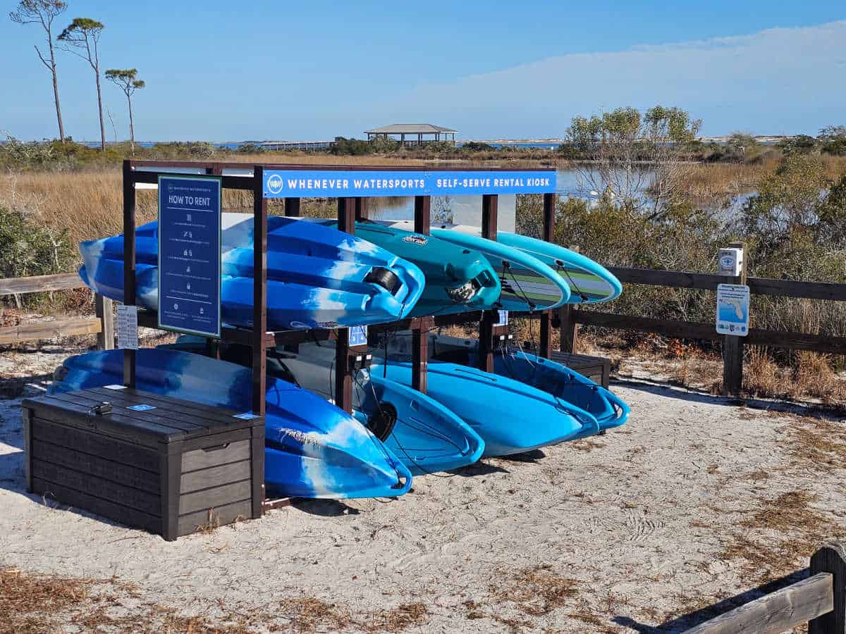 kayaks set up for rentals on a rack