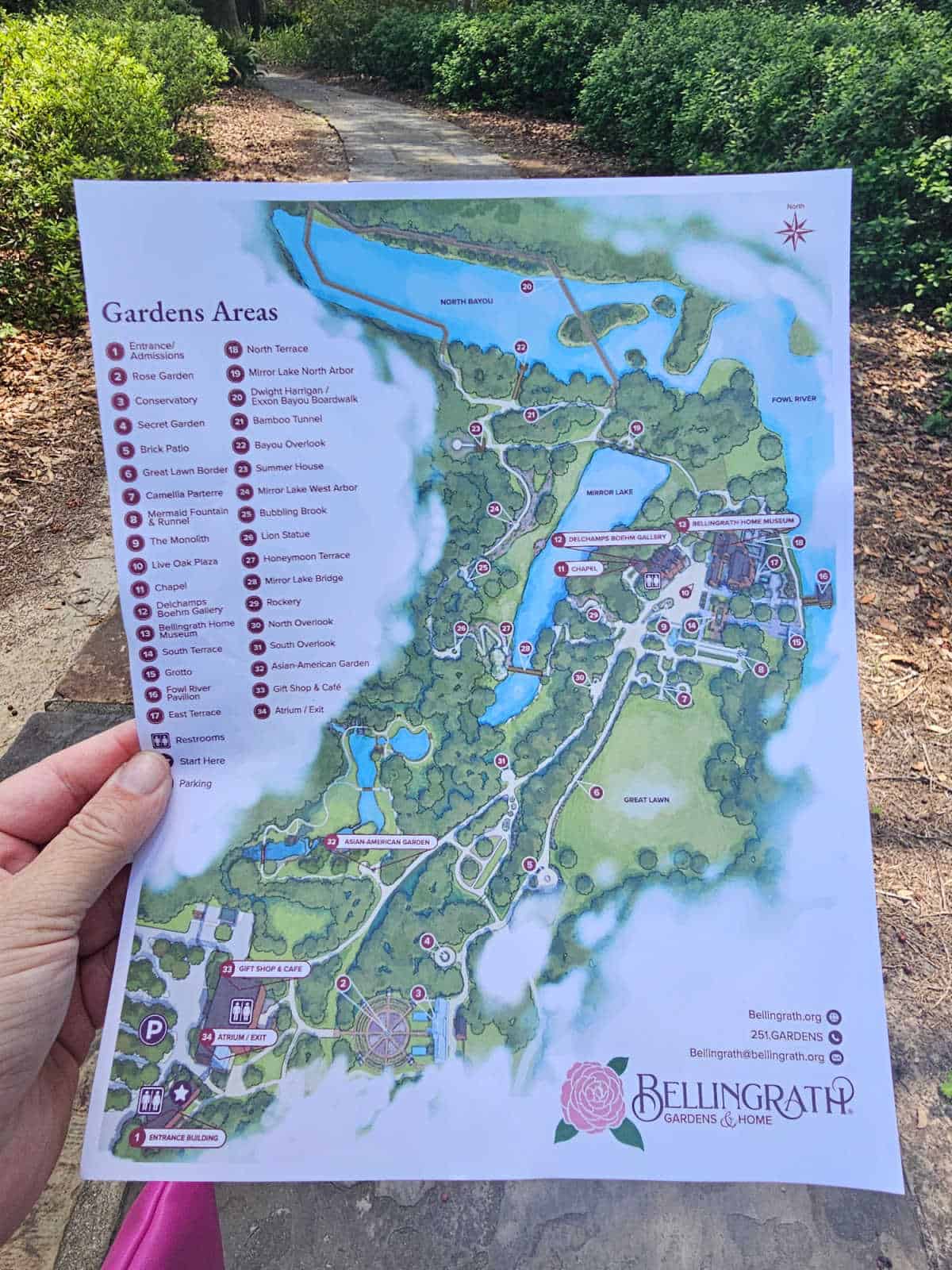 Hand holding a map of Bellingrath Gardens