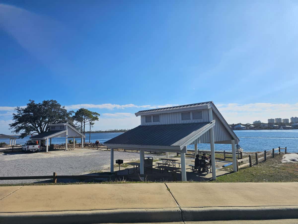 covered picnic areas near the water and trees
