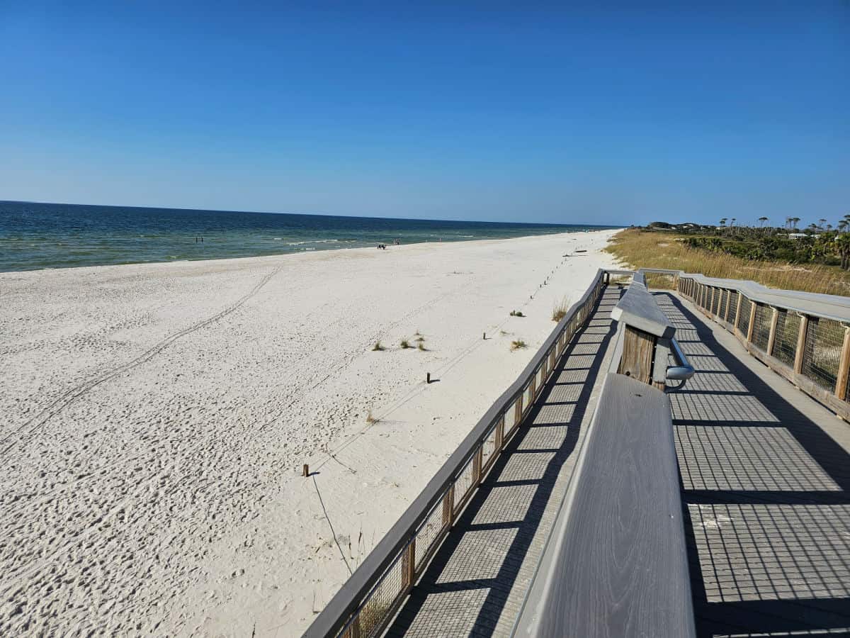 boardwalk down to the sand with the gulf on the left
