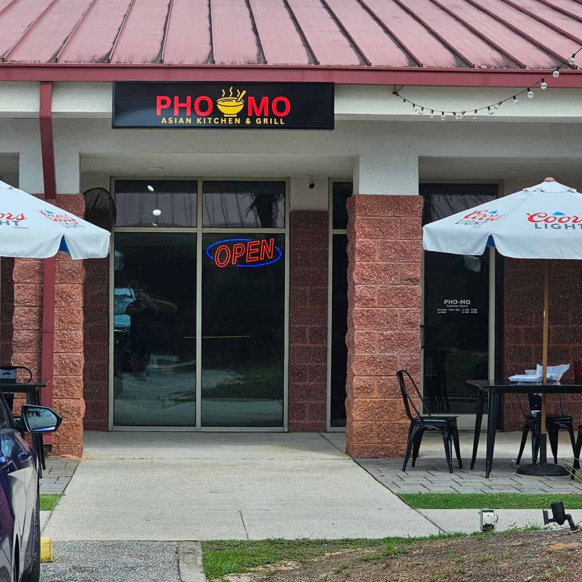 Pho Mo Asian Kitchen & Grill sign over a restaurant open sign