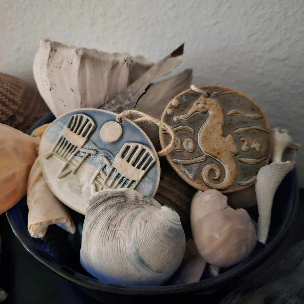 Gulf Shores Christmas Ornaments in a bowl with shells