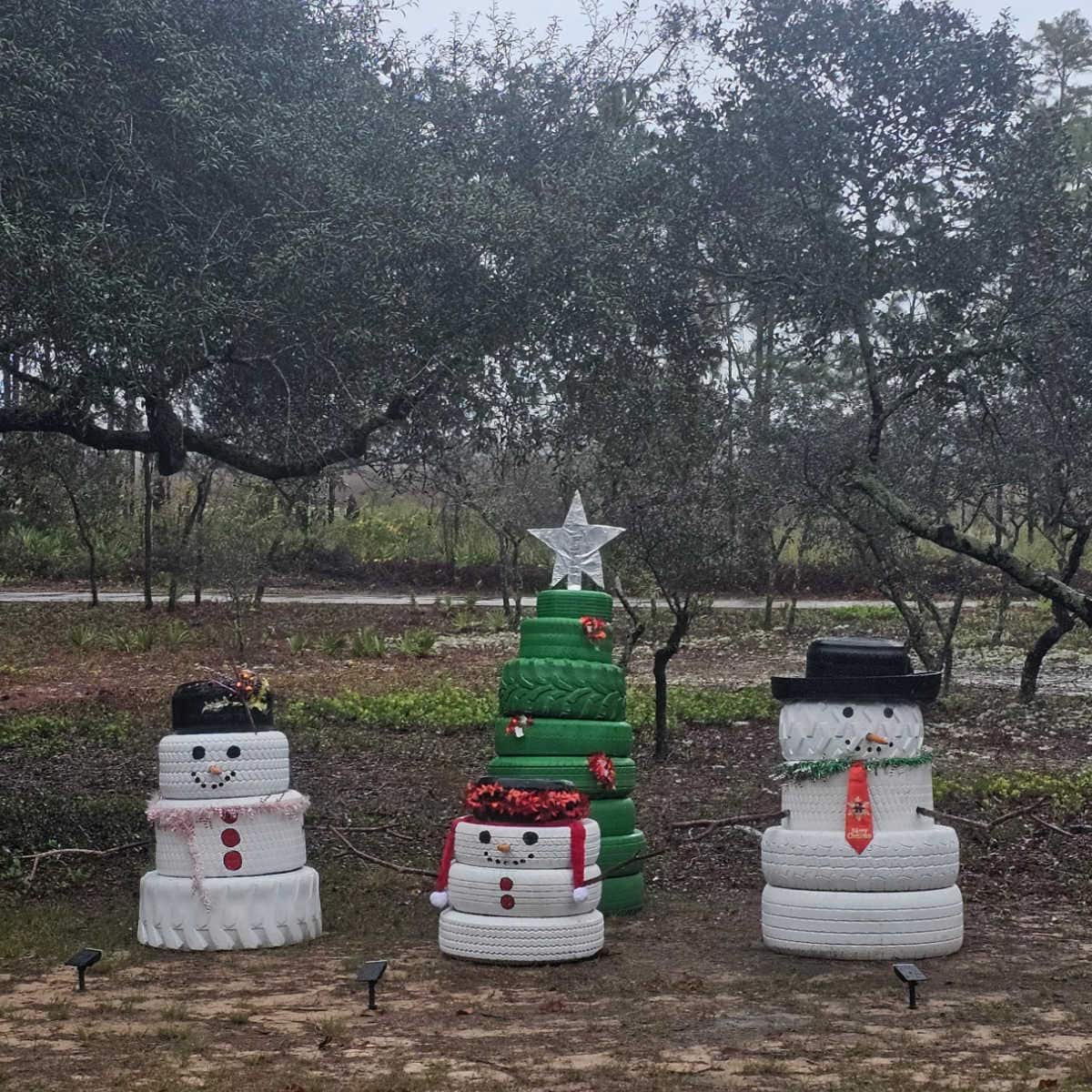Tires turned into snowmen and snow women and a xmas tree in Gulf State Park