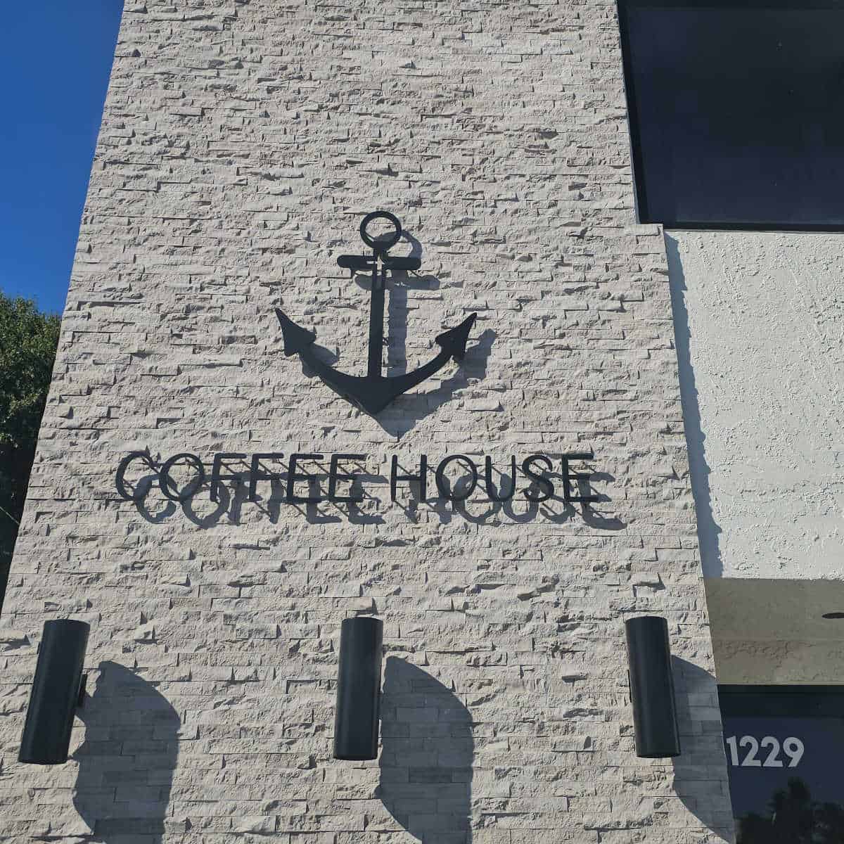 Anchor on a brick wall with coffee house under it
