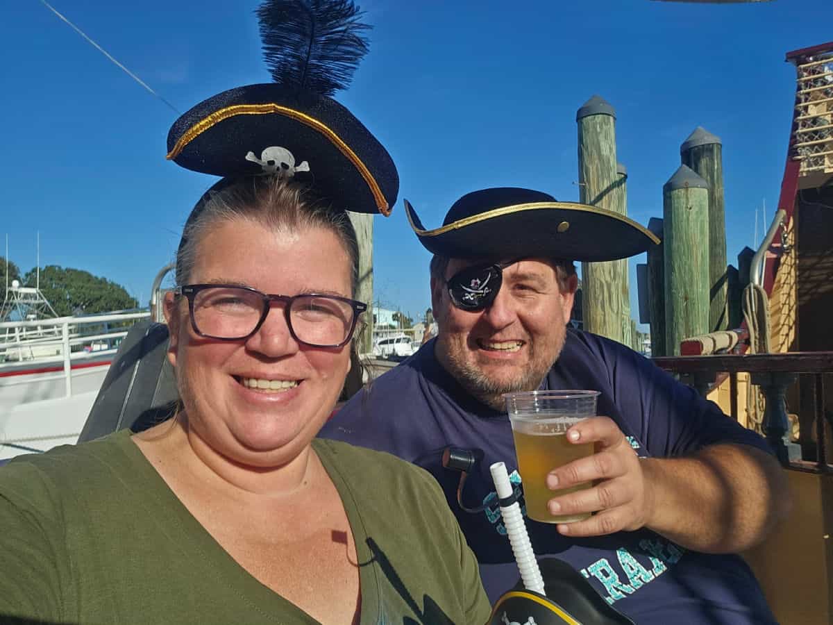 Tammilee and John wearing pirate hats