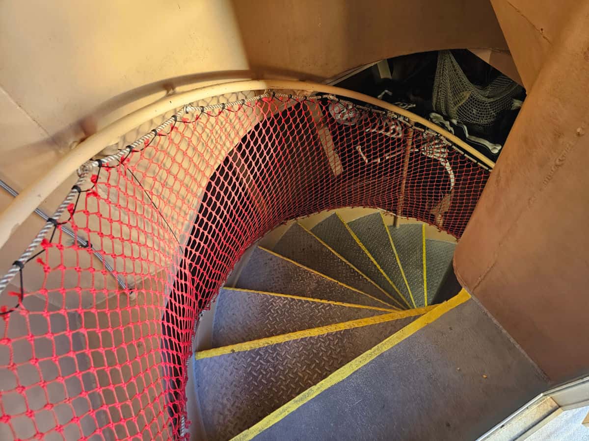 metal spiral staircase down into the pirate ship