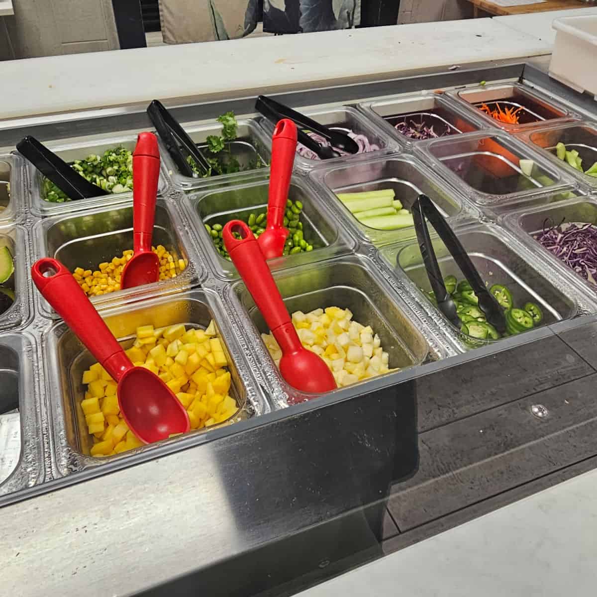 prep counter with containers of fresh vegetables
