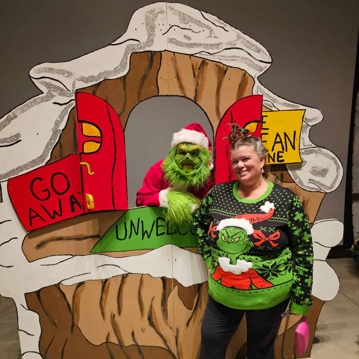 Tammilee standing with the grinch
