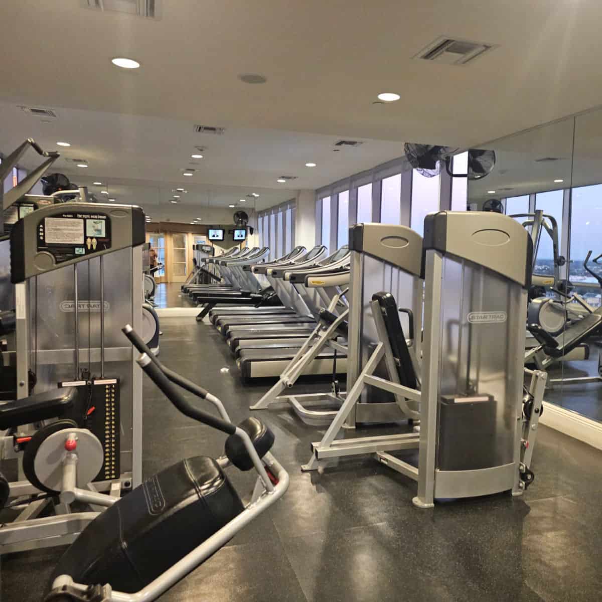 fitness center with treadmills and workout equipment