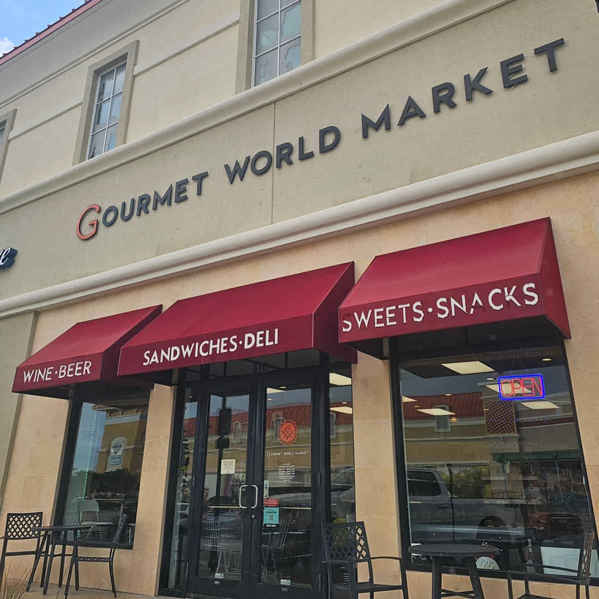 Gourmet World Mart sign over restaurant entrance