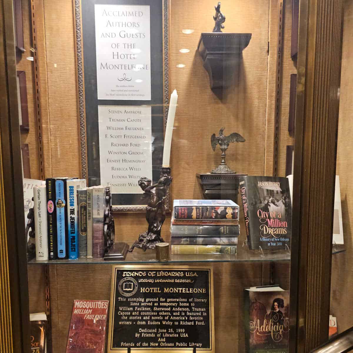 glass case with books an the Friends of Library Literary landmark Hotel Montleone plague