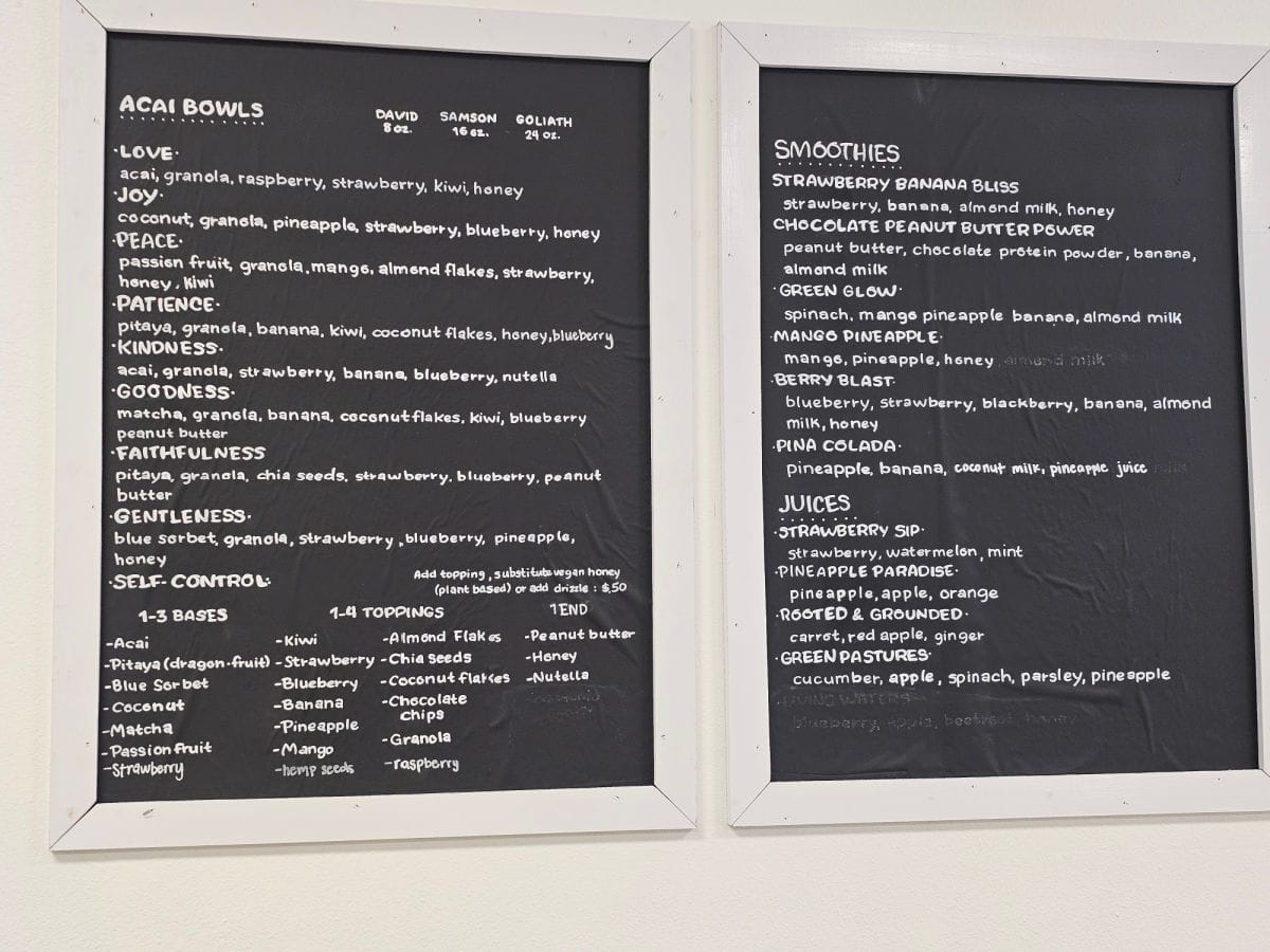 acai bowl, smoothies, and juices menu at Fruitful on a black board with white frame