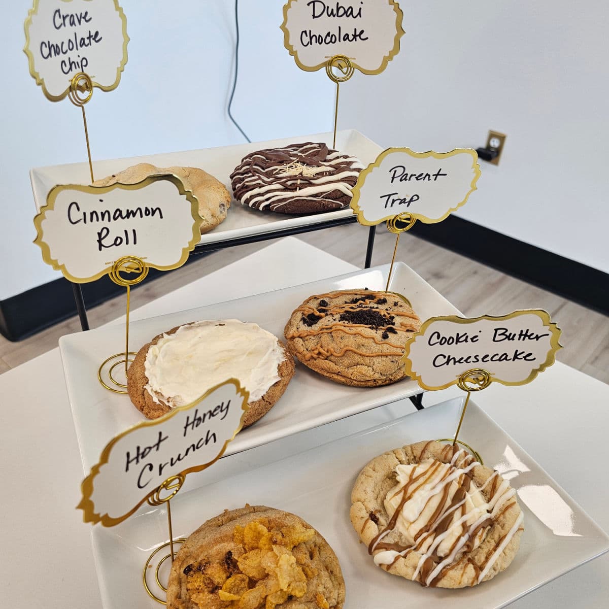 cookies on three trays with labels