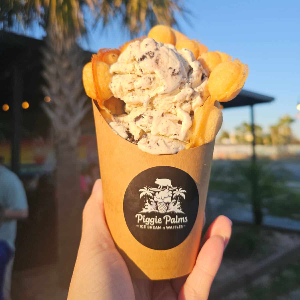 bubble waffle in a cup with cookies n cream ice cream