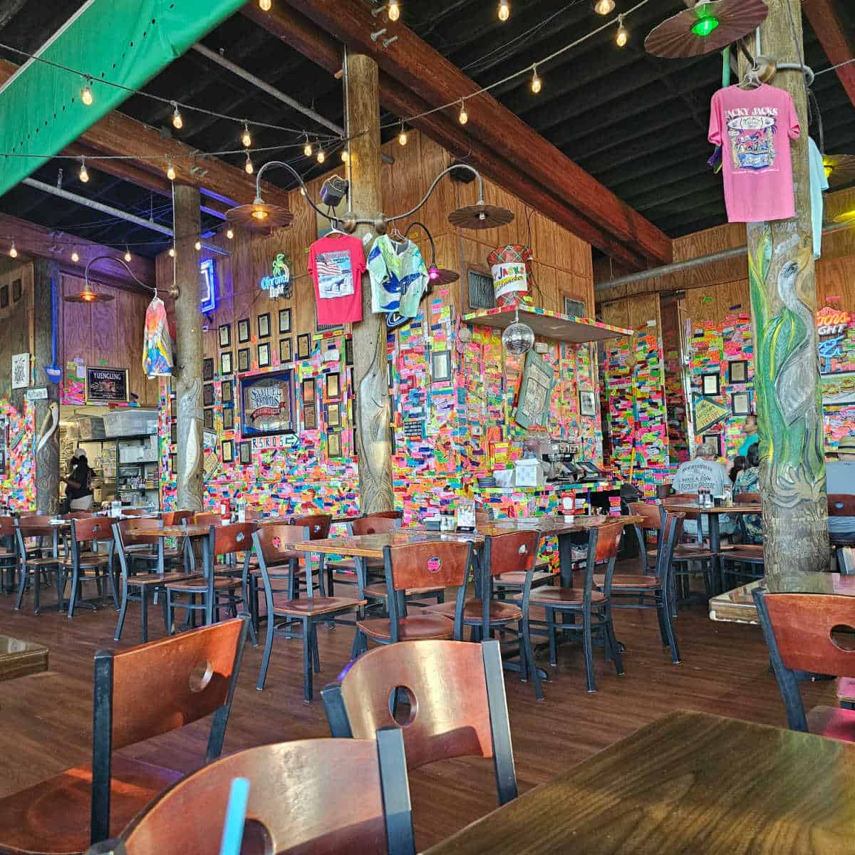 Tacky Jacks Gulf Shores interior with colorful tape on all of the walls and pilars.
