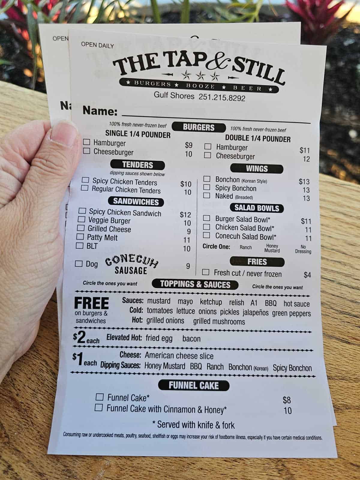 Tap & Still Gulf Shores menu with burgers, tenders, wings, sandwiches, and salad bowls