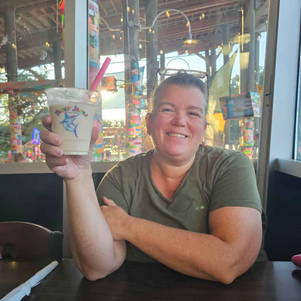 Tammilee holding a Tacky Jack's Bushwacker