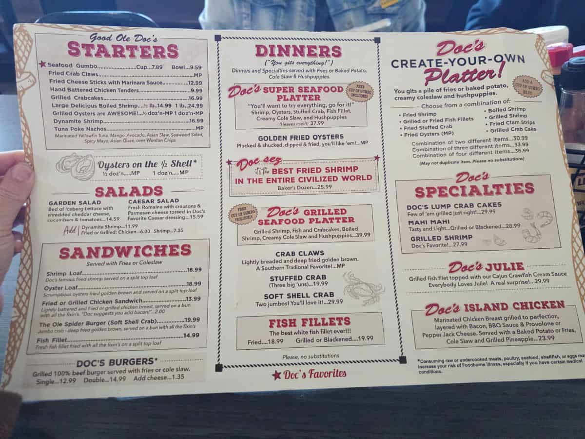 Doc's Seafood and Steak menu with starters, salads, sandwiches, dinners, and create your own platters
