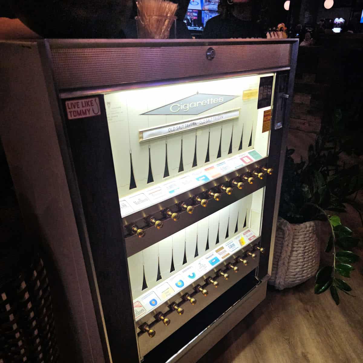 Retro cigarette machine turned into a hostess stand
