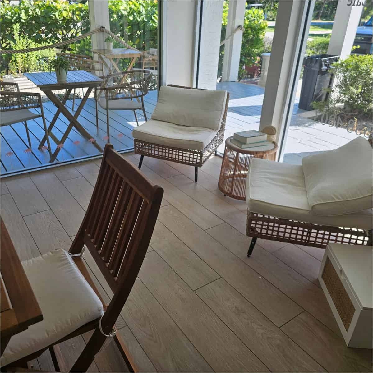 sanibel sprout indoor seating with white padded chairs next to a table