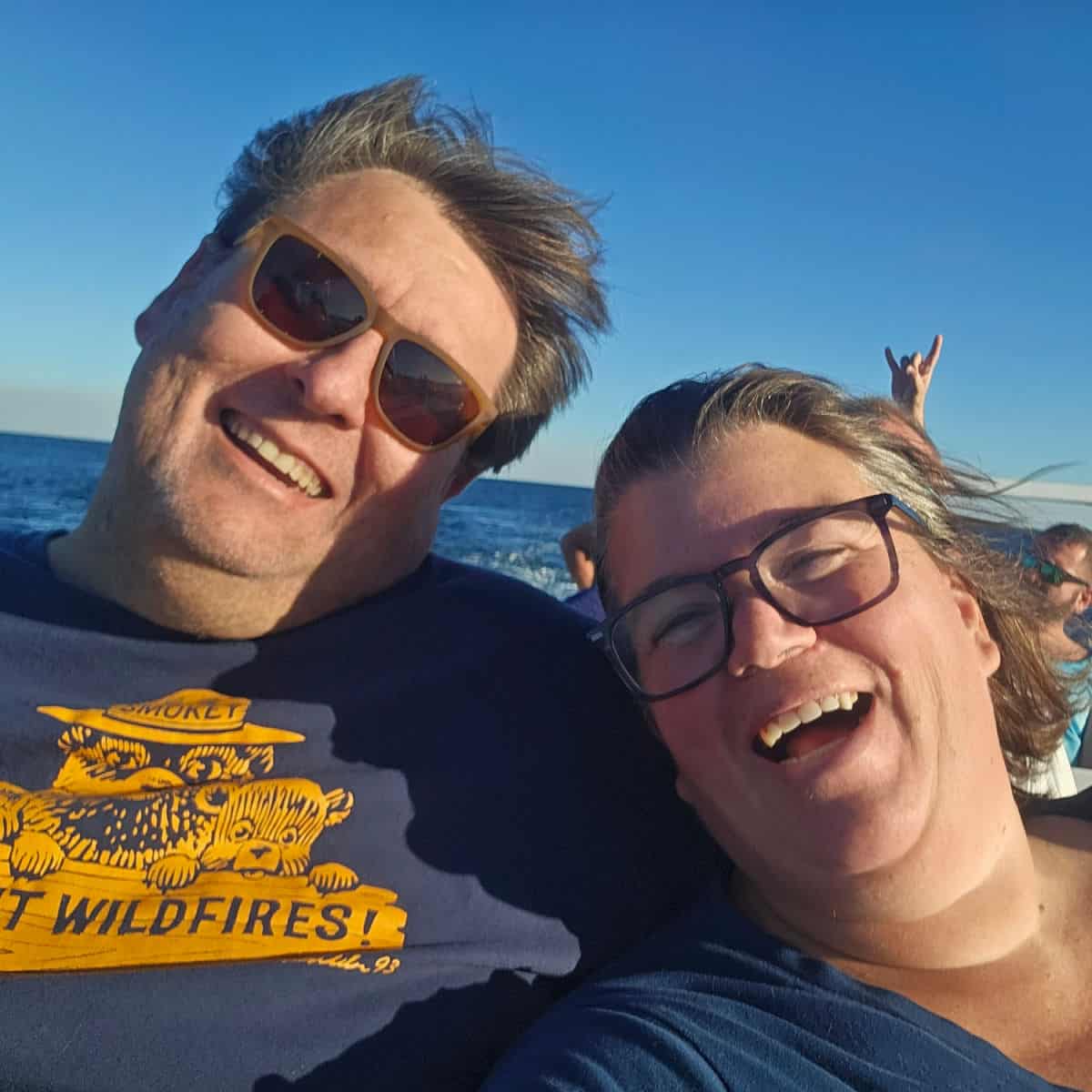 John and Tammilee laughing with wind in their hair on the Sea Blaster