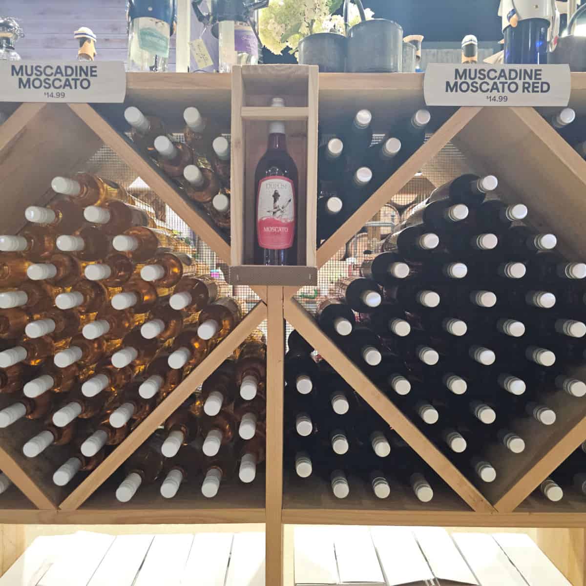 Muscadine Moscato in boxes with the bottles stacked on top of each other.