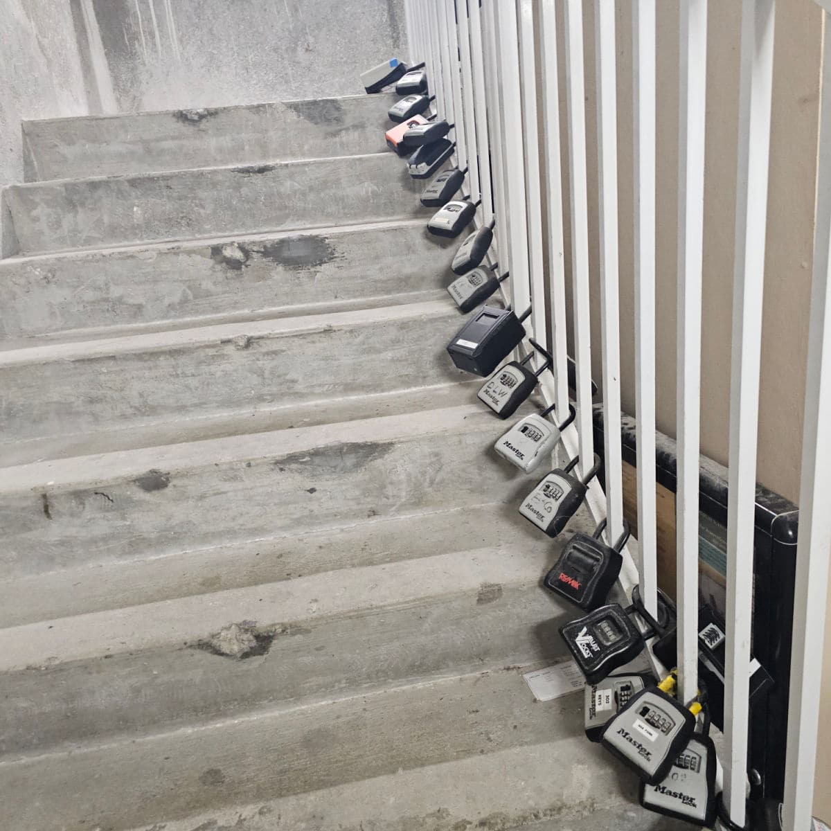 Locks attached to rails going up a stairwell