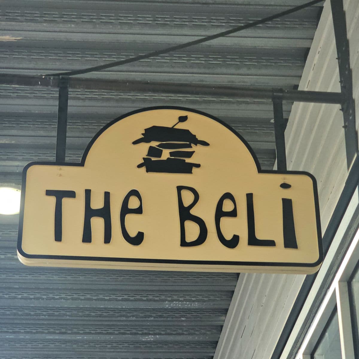 The Beli sign with a sandwich graphic above the name
