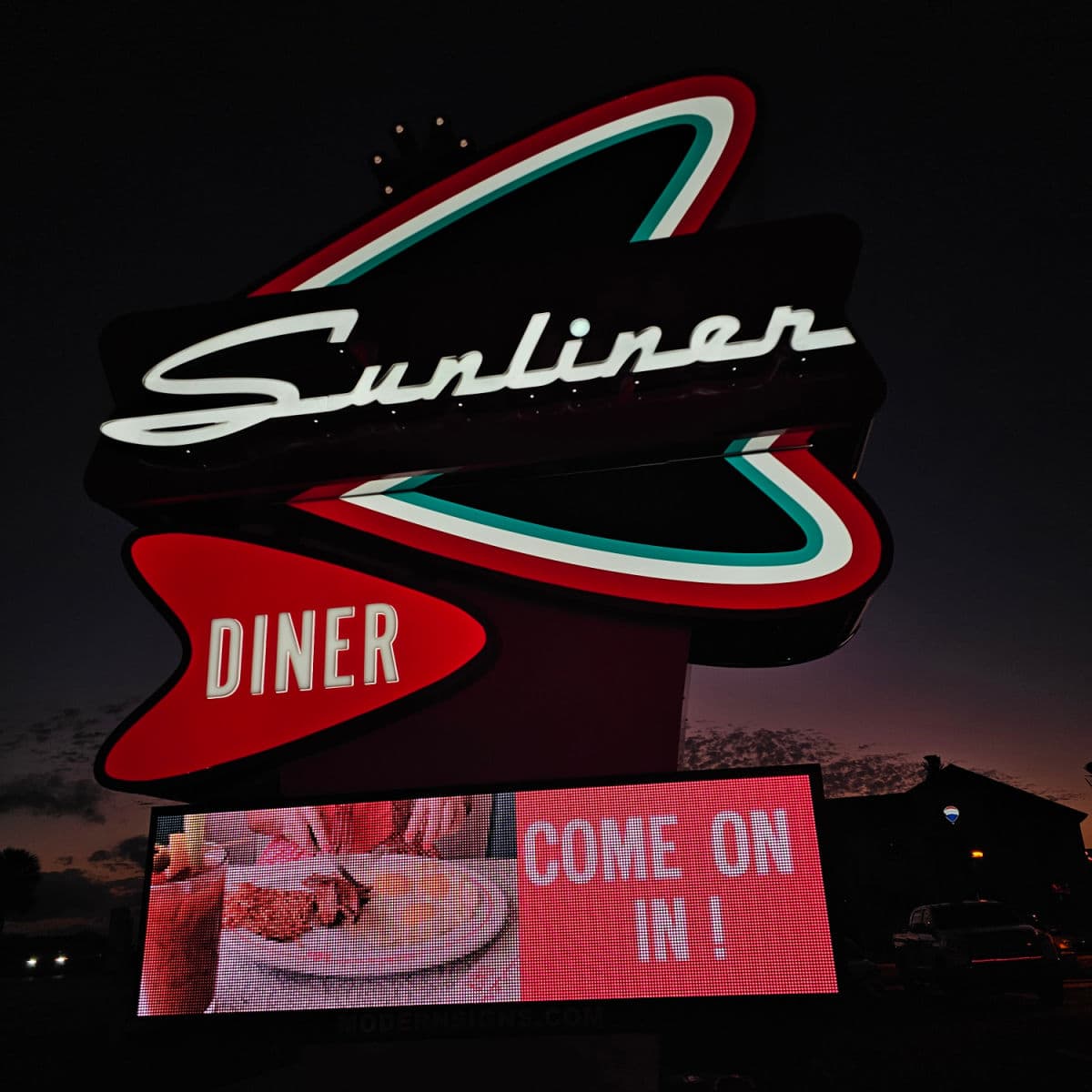 Sunliner Diner Sign at night with come on in on the video screen