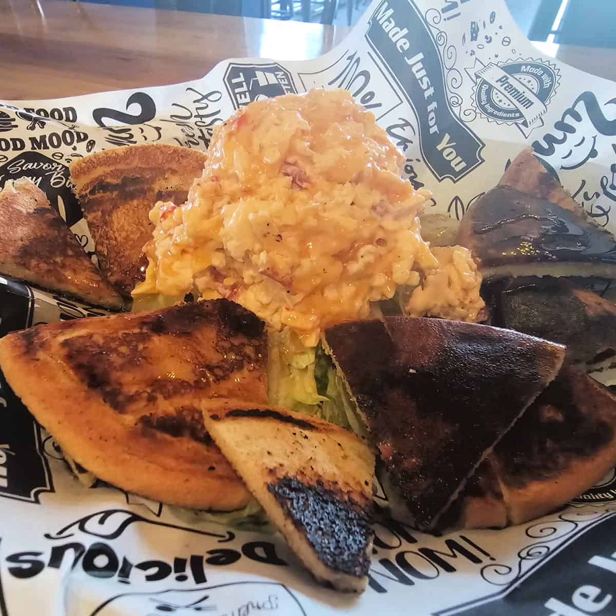 Pimento cheese in a basket with bread