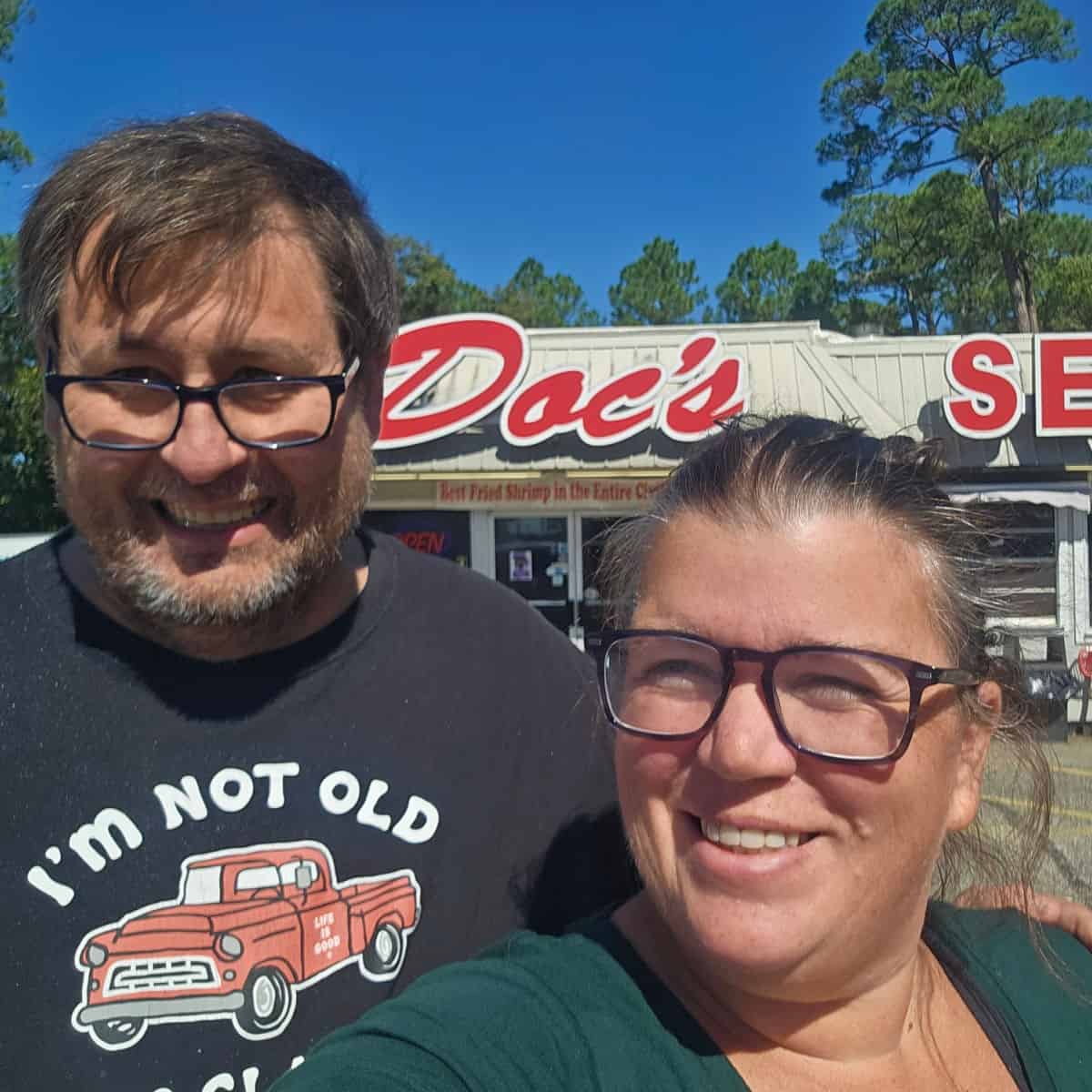 Tammilee and John in front of Doc's Seafood in Orange Beach