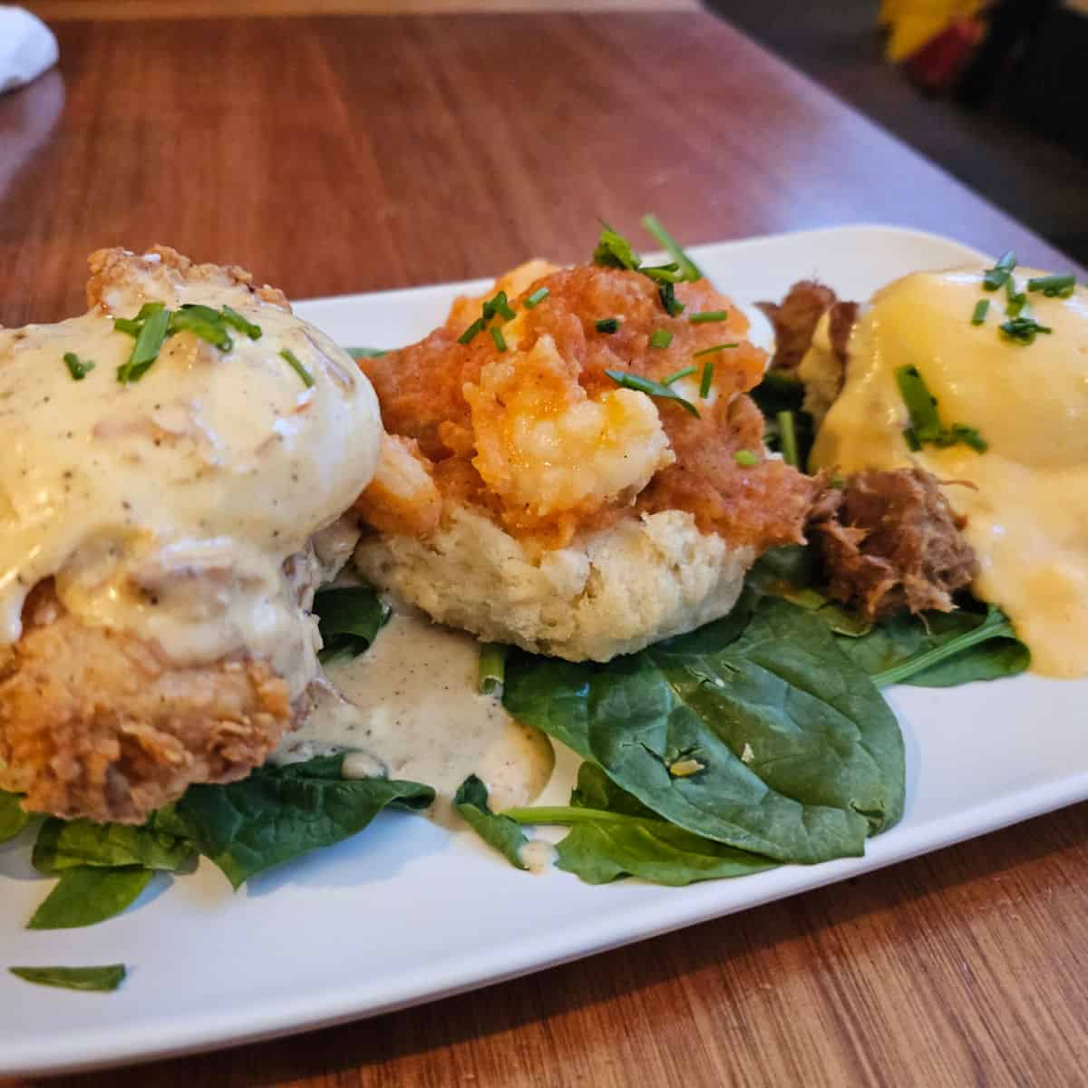 The trifecta of benedicts at Ruby Slipper with Eggs cochon, chicken St. Charles, and bayou shrimp benedicts