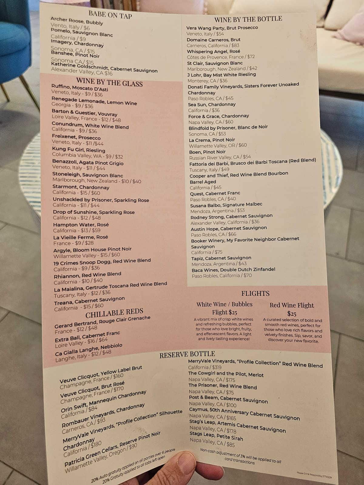 Gulf Babe pink and white menu with babe on tap, wine by the glass, reserve bottles, and wine by the bottle
