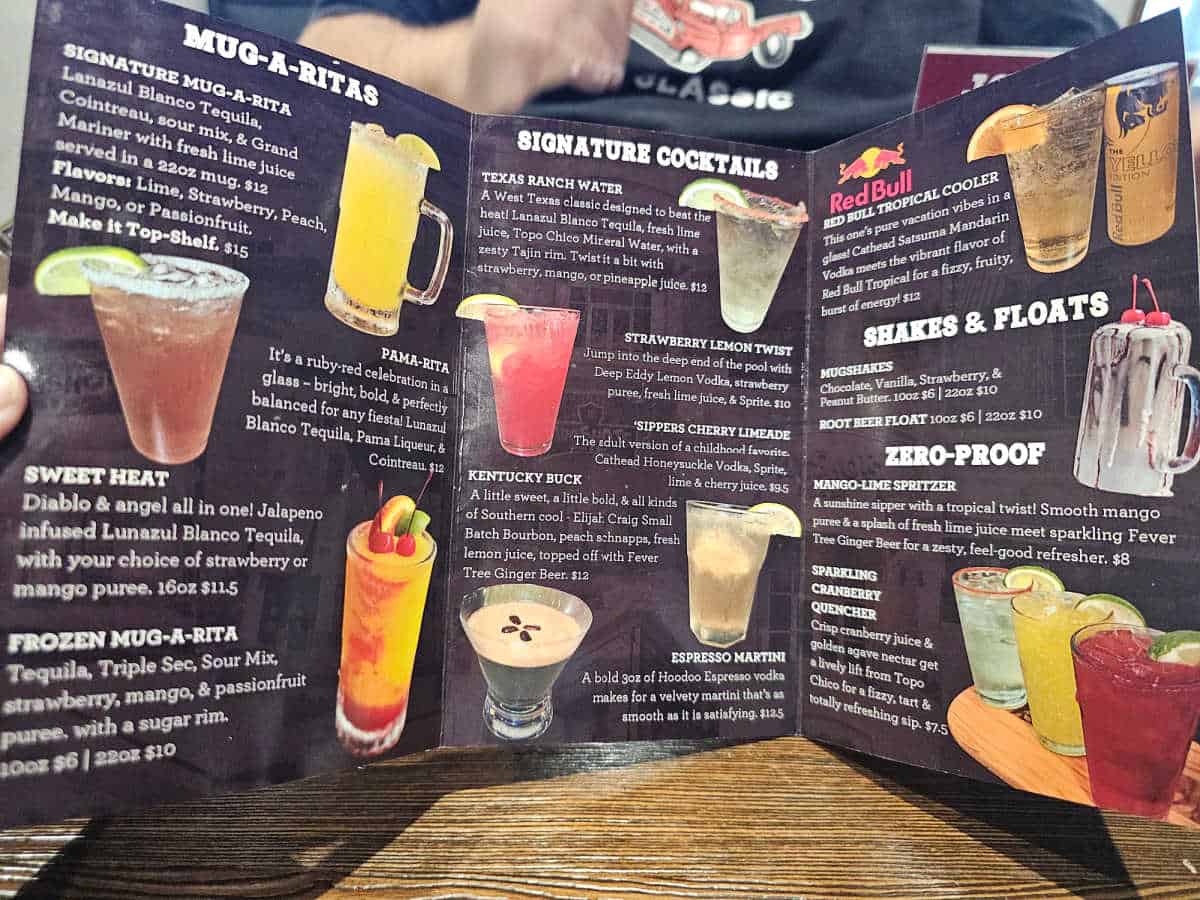 mugshots drink menu with mug-a-ritas, signature cocktails, shakes & floats, and zero-proof