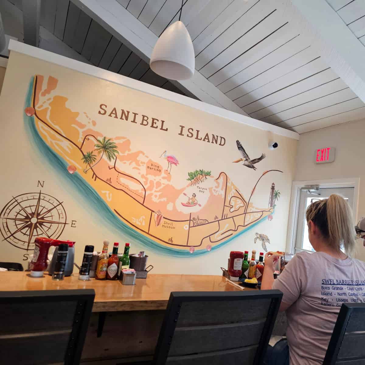 Sanibel Island mural on the back wall behind a bar