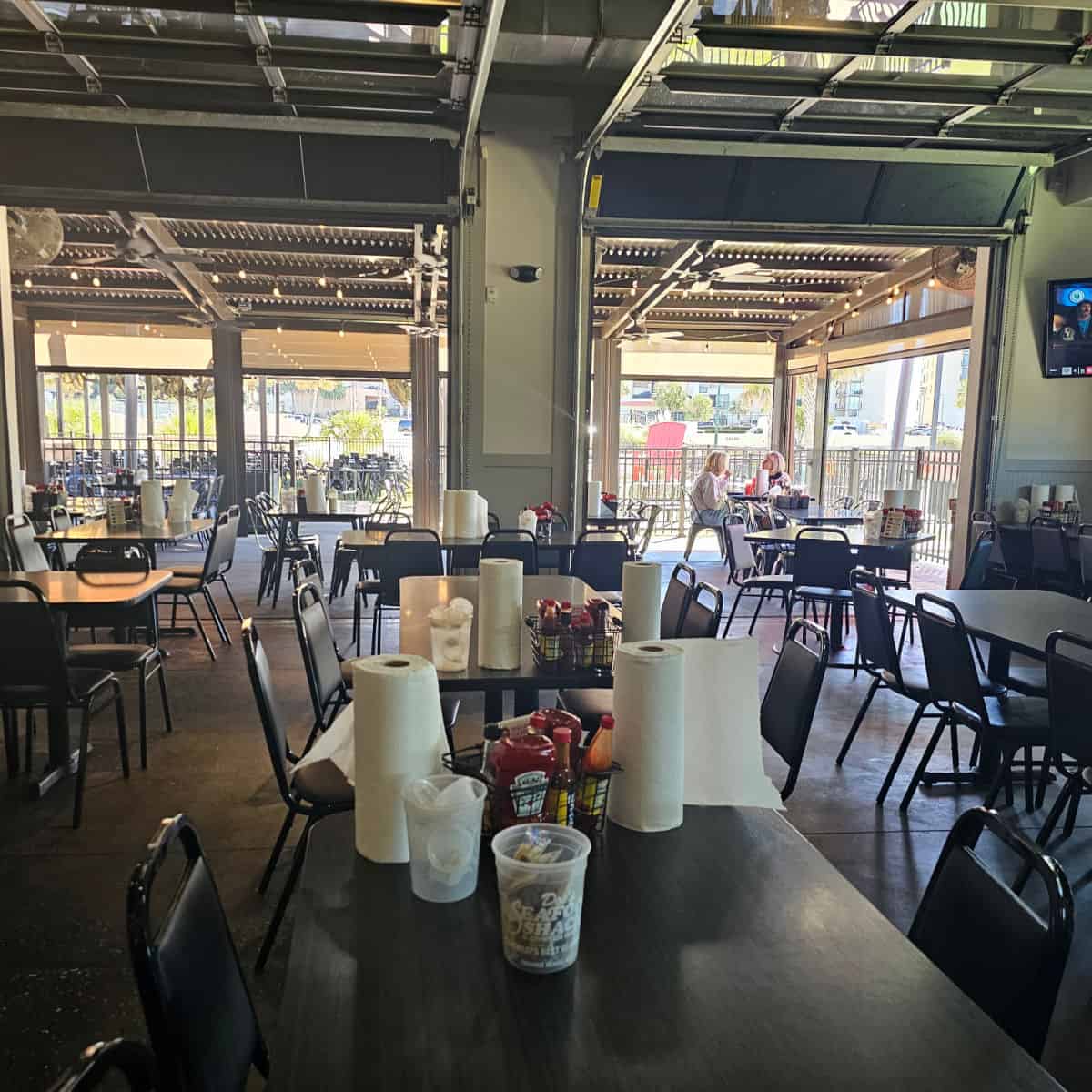 Doc's Seafood & Steaks indoor seating looking out towards the covered outdoorseating,