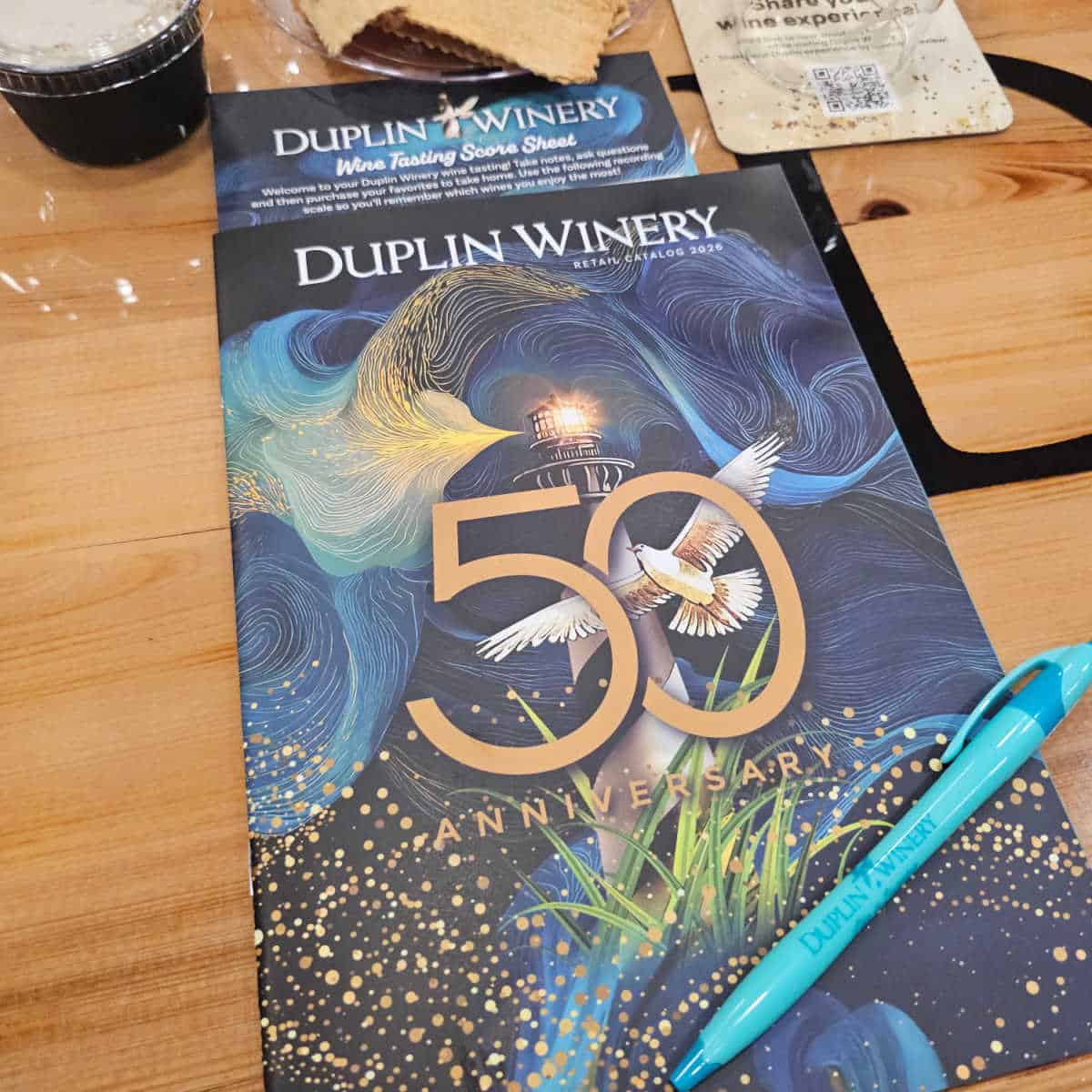 Duplin Winery 50th Anniversary Catalog with Duplin Winery pen on top of it