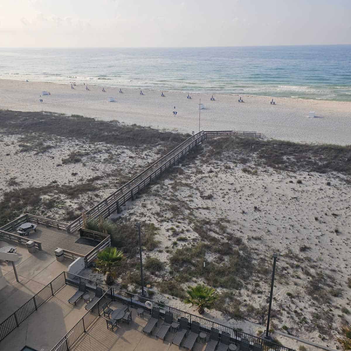 boardwalk over the sand dunes to the beach and Gulf in the background