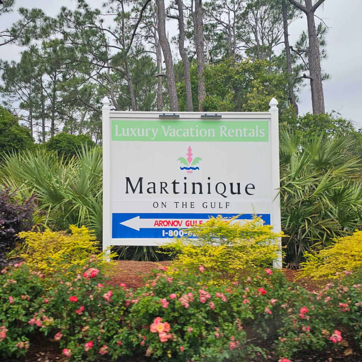 Martinique on the Gulf sign surrounded by tropical plants